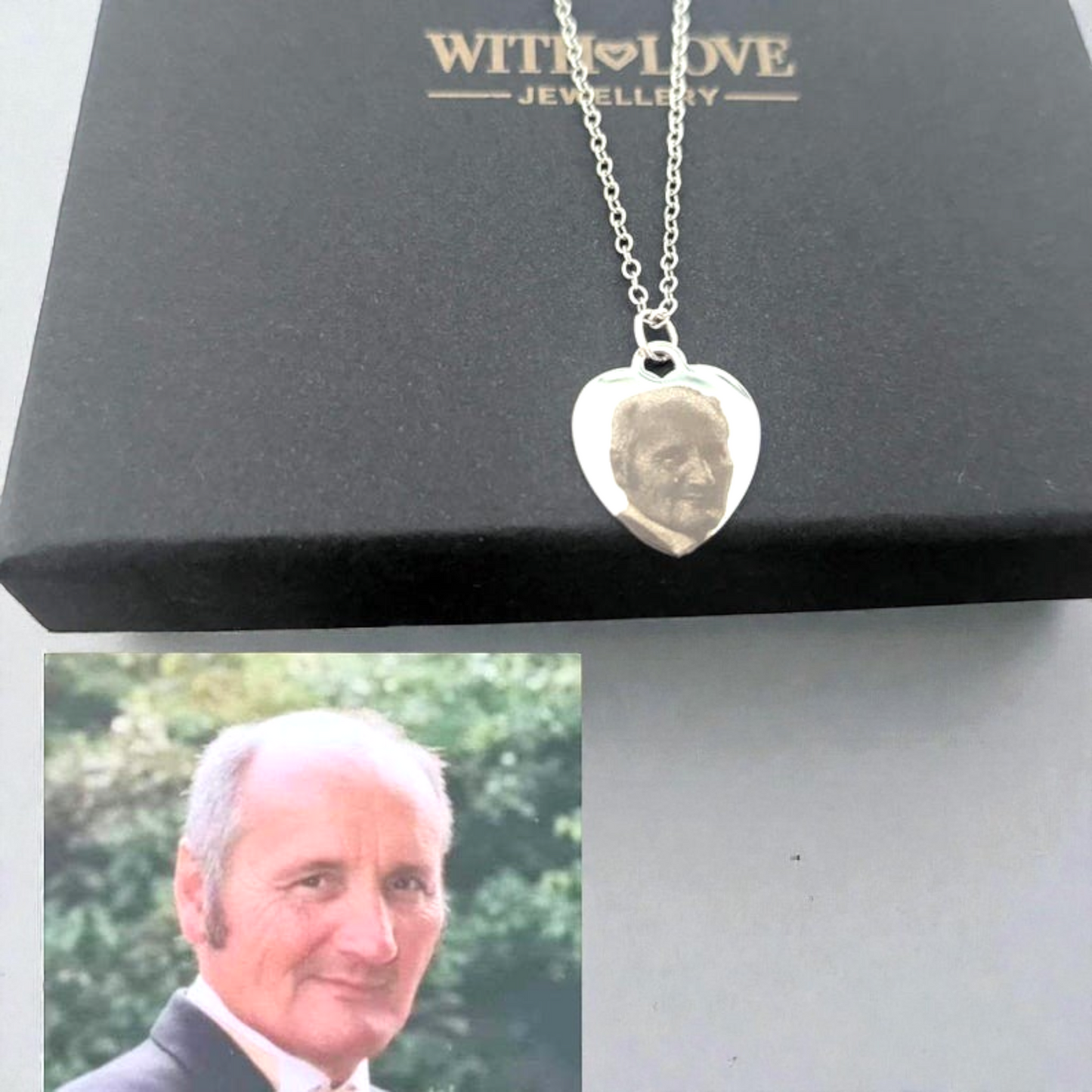 Heart-shaped silver pendant with engraved face on a 'WITH LOVE JEWELLERY' box.