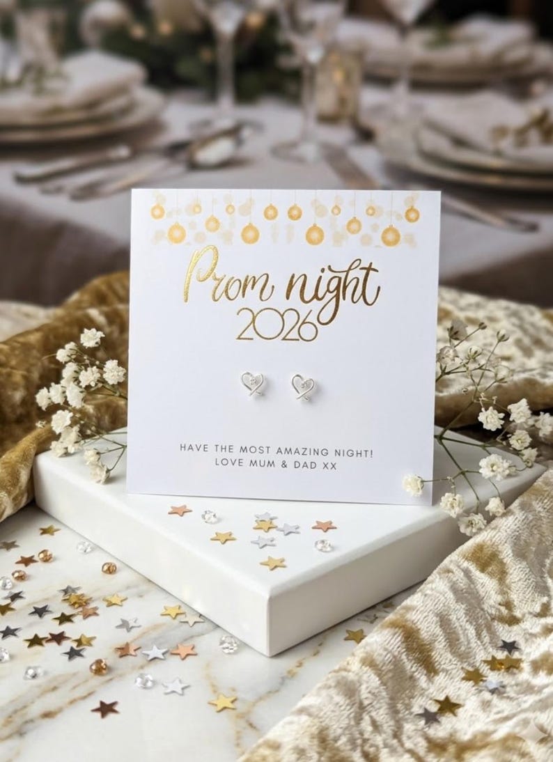 Prom night 2026 card with earrings on a decorative table setting.