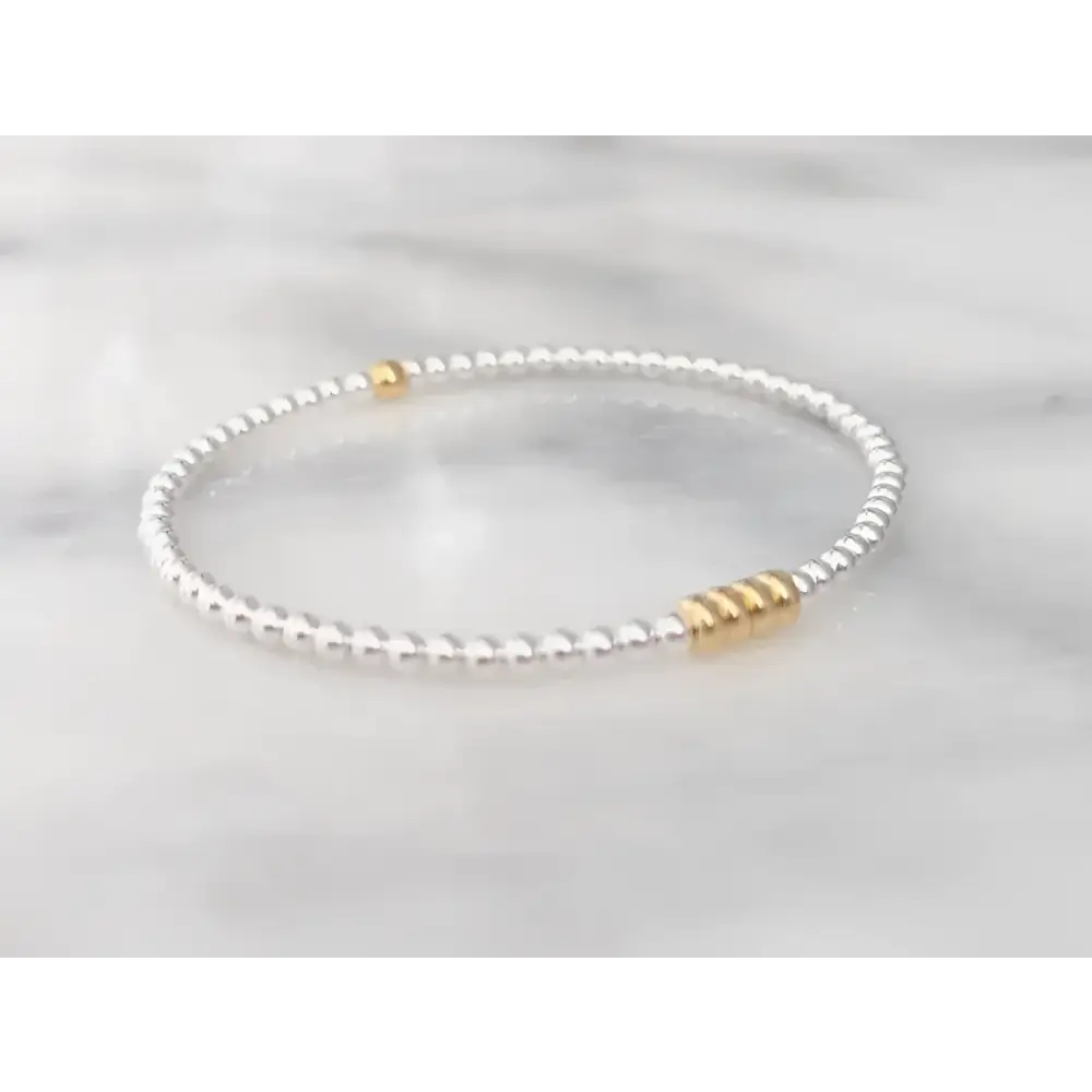 A sterling silver beaded 50th milestone birthday bracelet gift on a white background